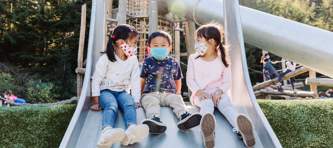Kids on playground slide