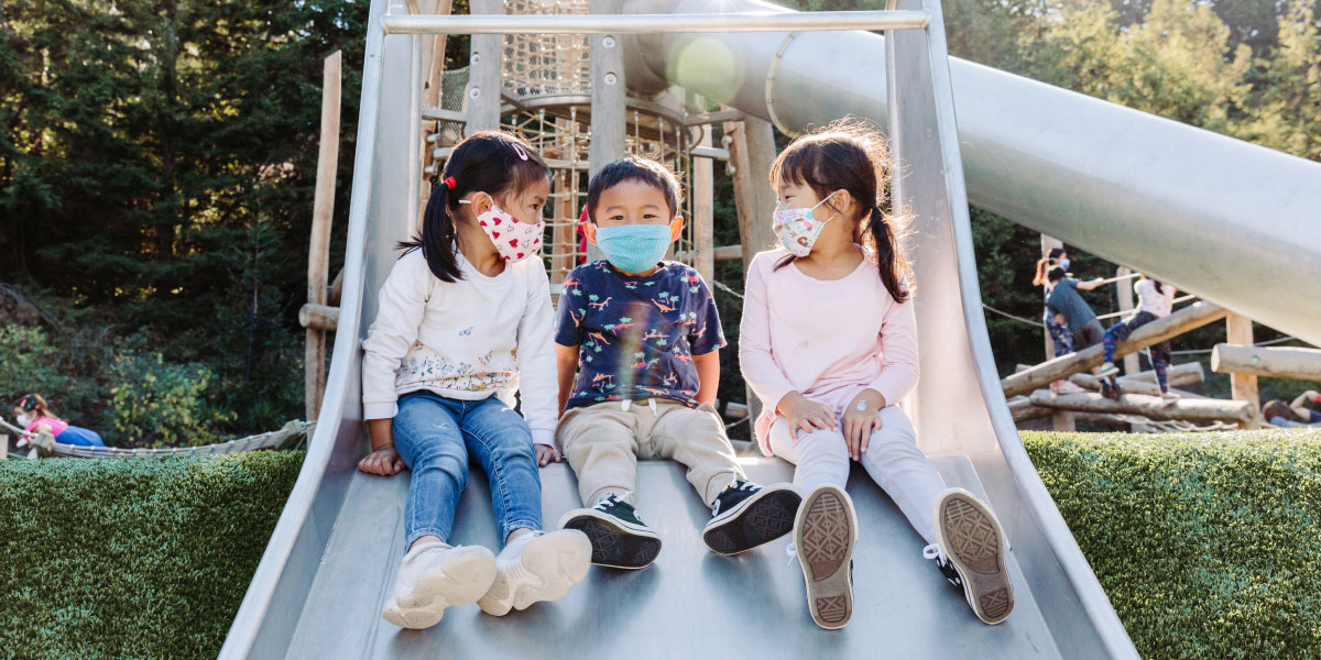 Kids on playground slide
